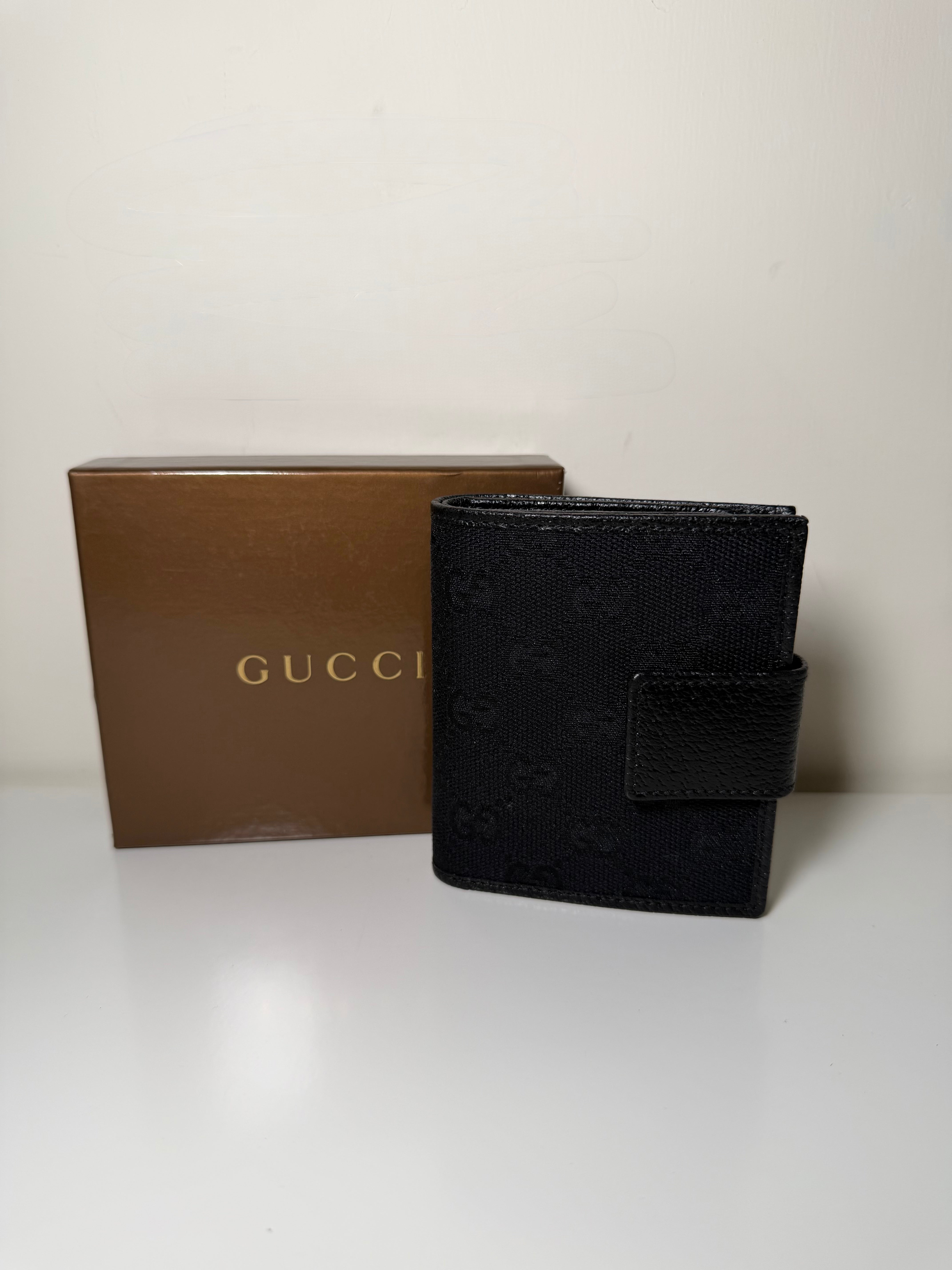 Portafoglio Bi-Fold Gucci in Tela GG Nera e Pelle