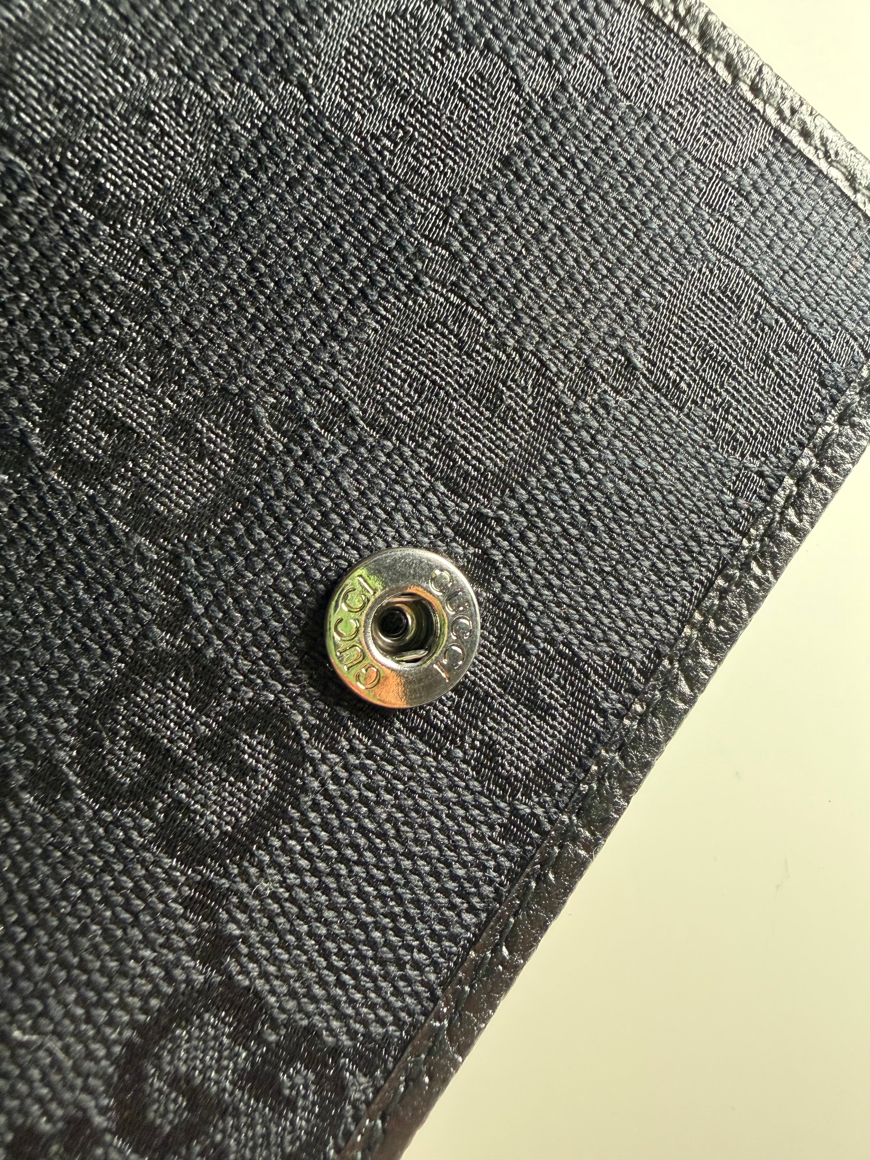 Portafoglio Bi-Fold Gucci in Tela GG Nera e Pelle