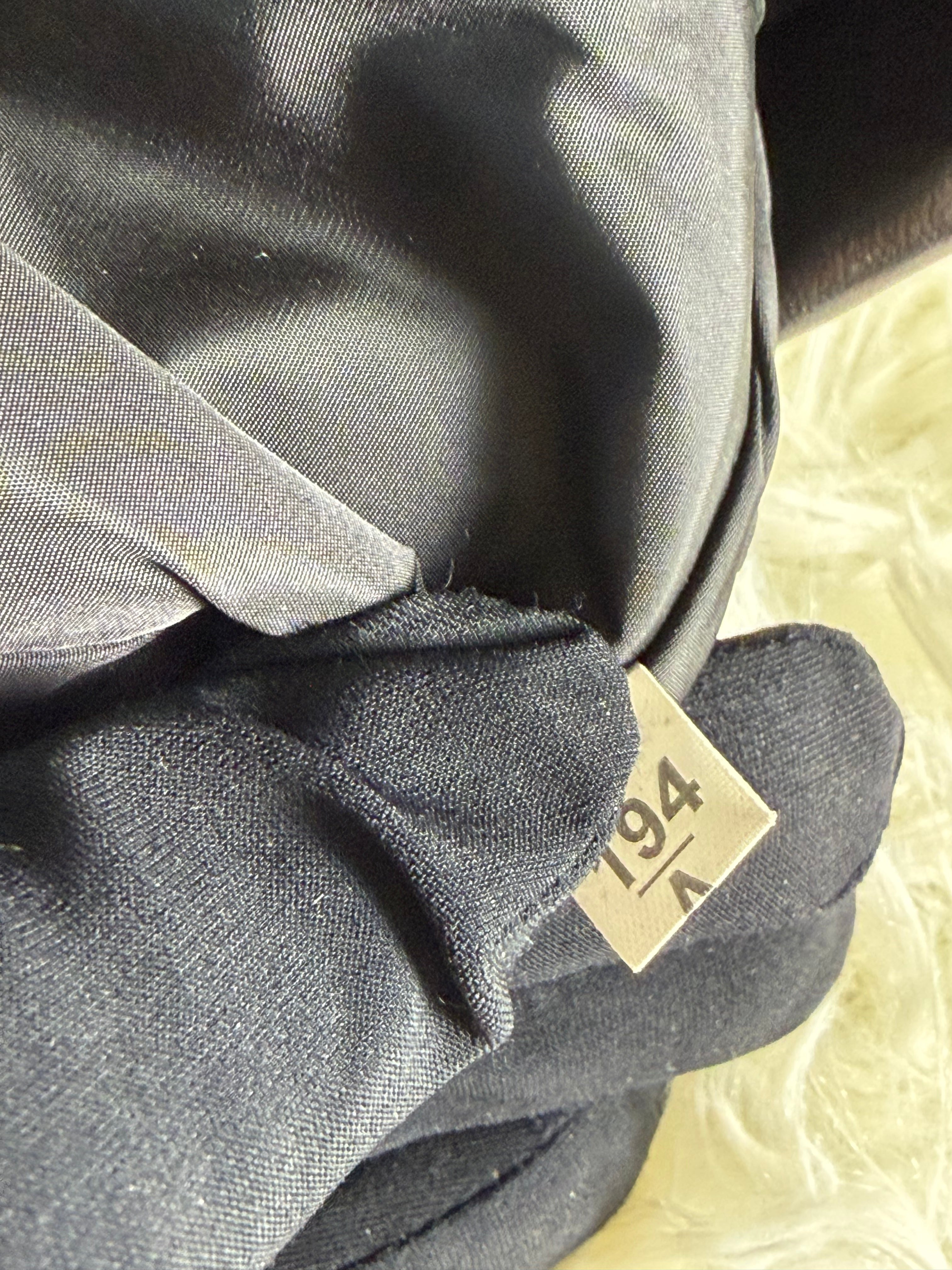 Pochette in Pelle Nera di Miu Miu con Borchie Dorate